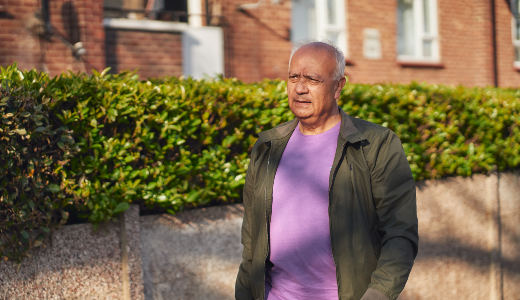 Male walking along road