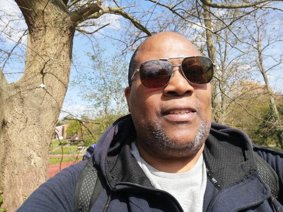 Cancer patient Alfred taking his daily walk on a sunny day