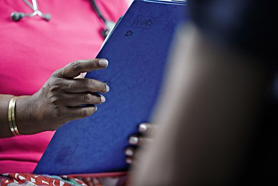 GP holding a clipboard