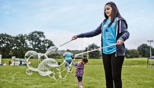 girl playing with bubbles