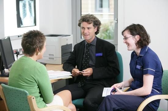 Image of a GP and their Patient 