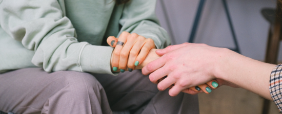 someone holding another person's hand