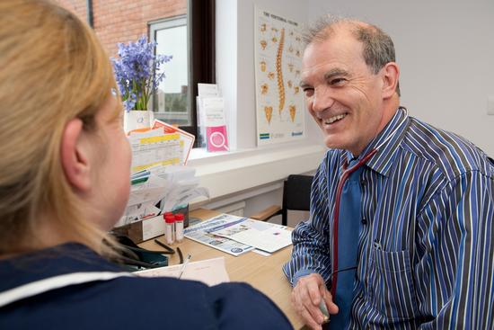 Image of GP and nurse chatting