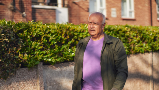 Man walking outside looking concerned Man walking outside looking concerned