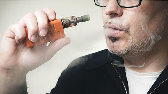 man using e-cig