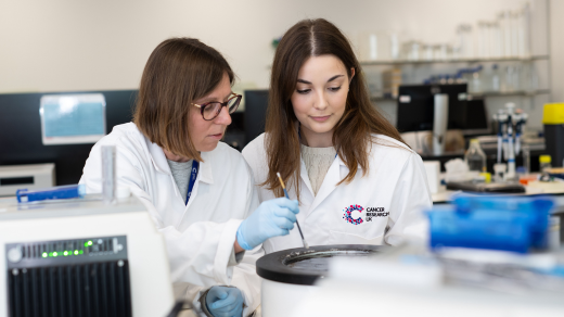 Two researchers working in the lab Two researchers working in the lab