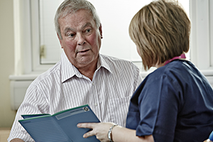 Image of doctor speaking to patient