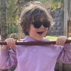 A photo of Oliver smiling to the camera on holiday