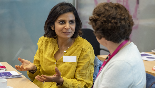 Patient panel members chatting