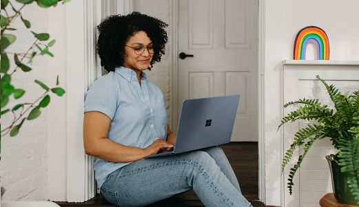 Woman at home on laptop