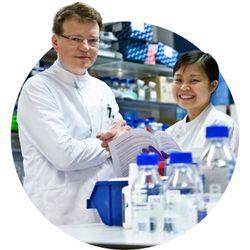 A male and a female scientist in a research lab