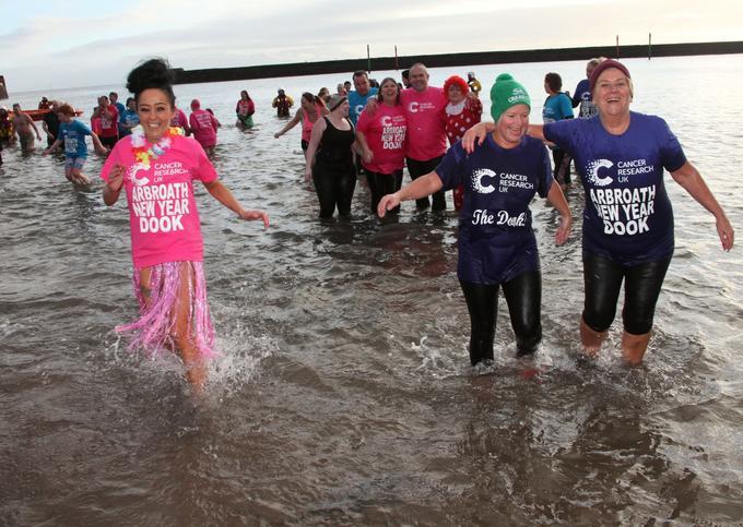 marathon runners on the beach