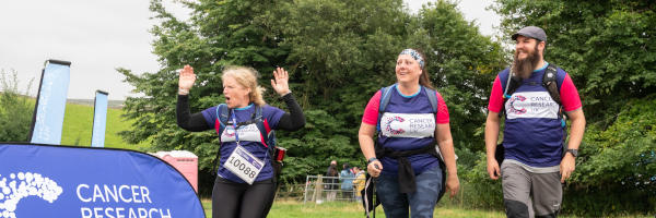 Participants being cheered at the finishing line