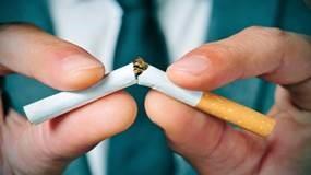 Image of someone snapping a cigarette in half