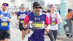 Man running in CRUK top