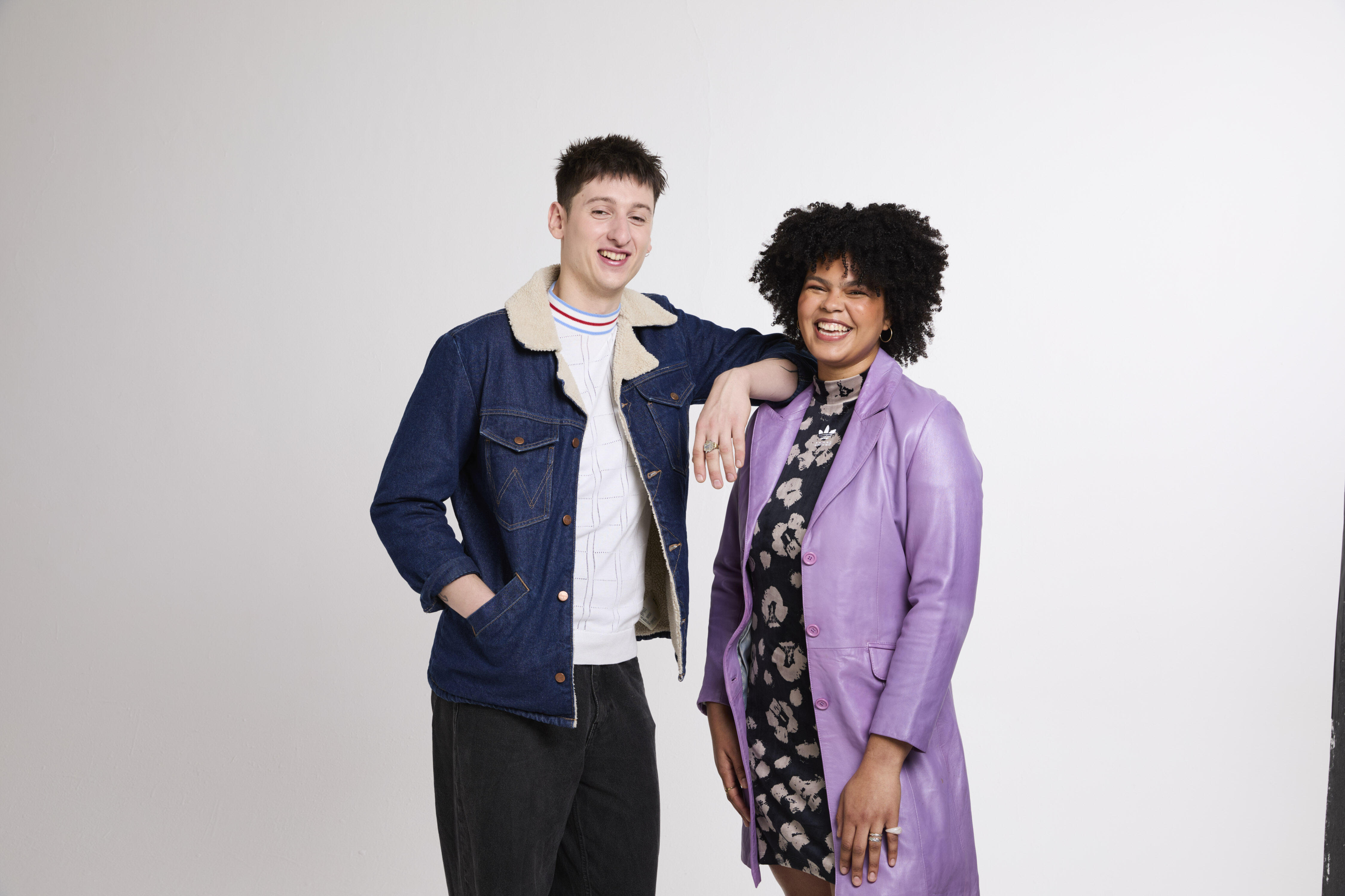 A smiling model wearing a red and white striped jumper.