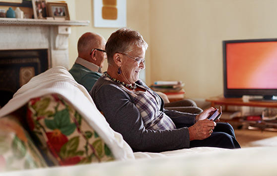 woman using mobile device at home