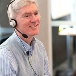 Male nurse wearing a telephone headset