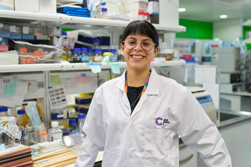 image of female scientist smiling in a laboratory