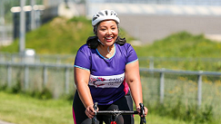 CRUK cyclist enjoying an event