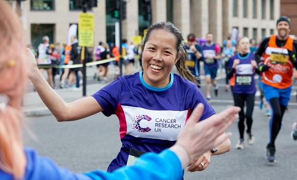 CRUK runner enjoying a half marathon