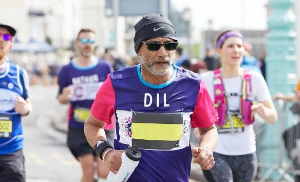CRUK runner enjoying a marathon