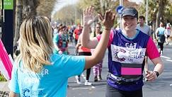 CRUK runner giving a high five