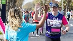 CRUK runner giving a high five