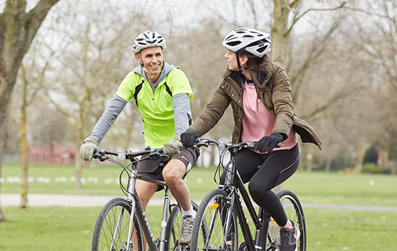 Two people cycling