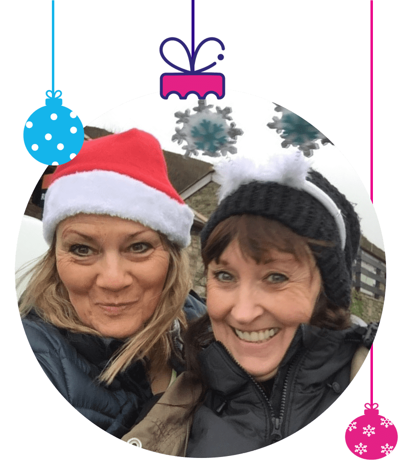 Woman in Christmas hat and friend