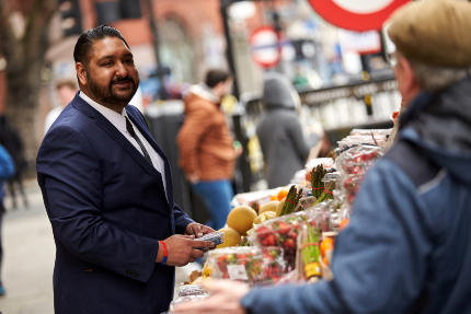 customer looking at food choices at a market