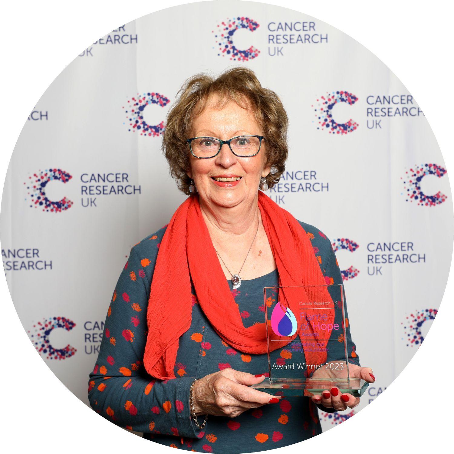 Elisabeth holding her Flame of Hope trophy