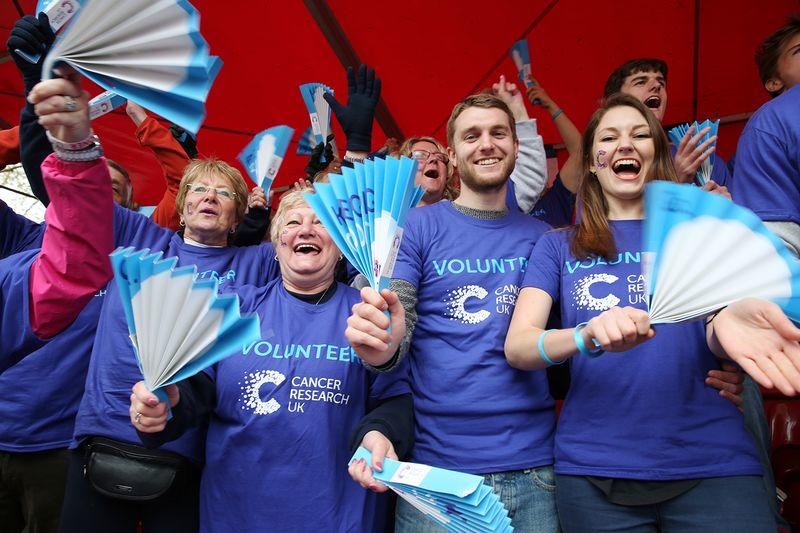 Volunteers cheering at an event