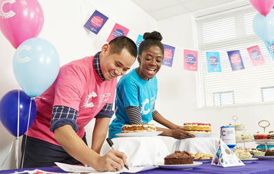 Cancer Research UK fundraisers at a bake sale 