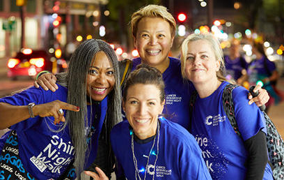 Four women smiling at the camera at Shine Night Walk
