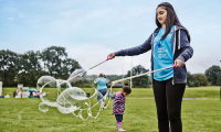 girl playing with bubbles