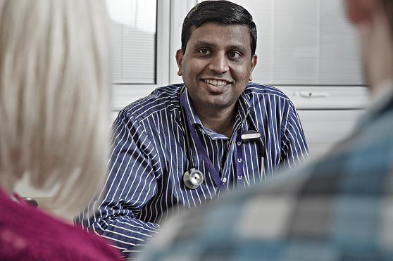 A couple talking to their doctor