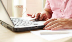 Man browsing on laptop