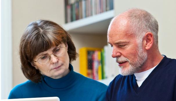 Couple looking at laptop screen