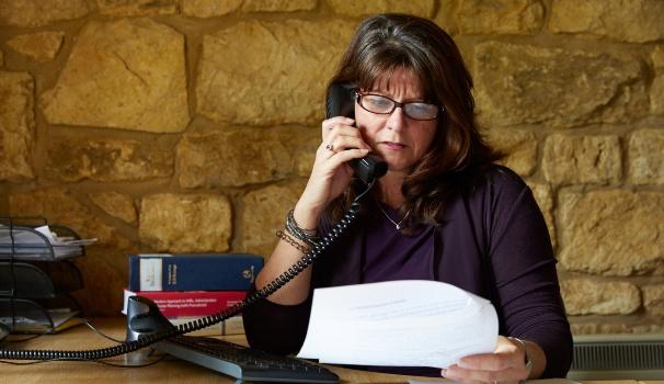 Woman looking at Will documents Woman looking at Will documents