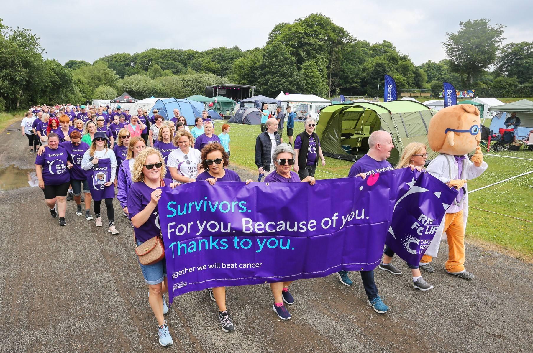 Relay participants completing the lap of honour
