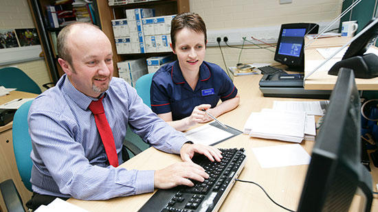 2 people at a computer