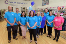 The Cancer Research UK Holyhead superstore staff and volunteer team