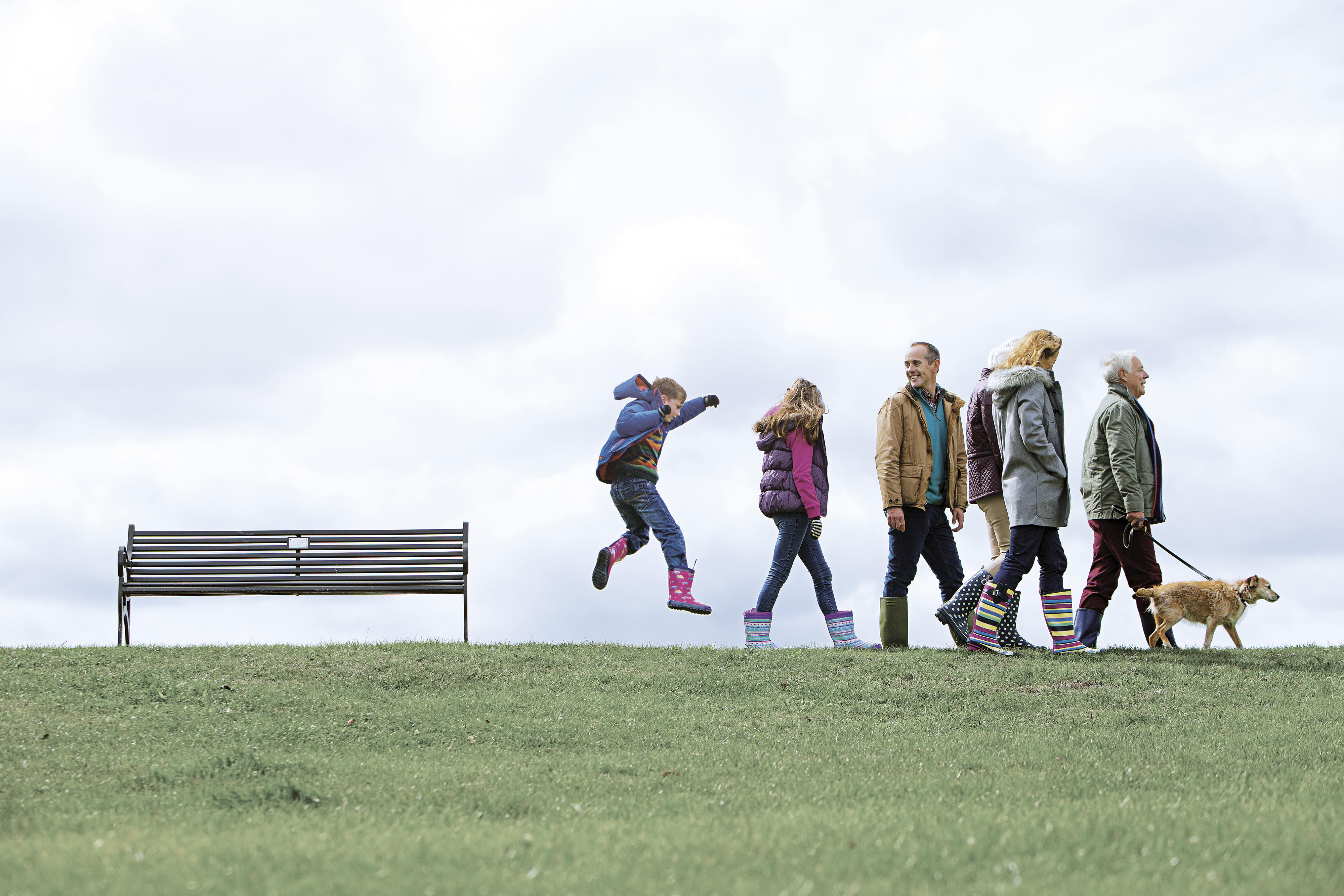 Group of people walking with dog