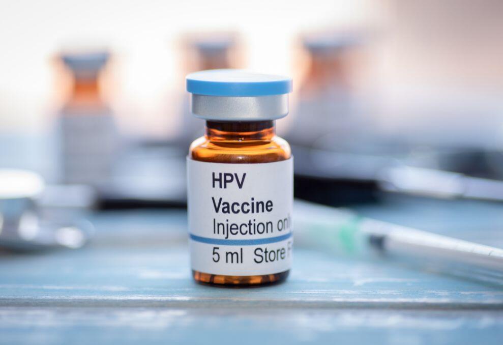 HPV vaccine bottle on a table HPV vaccine bottle on a table