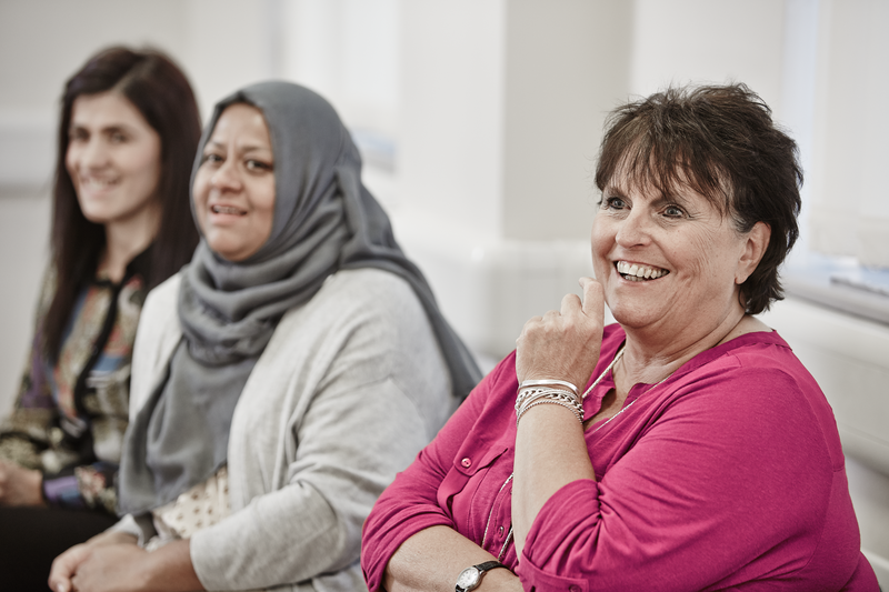 Three women sat down talking