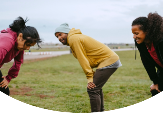 image of three people catching their breath