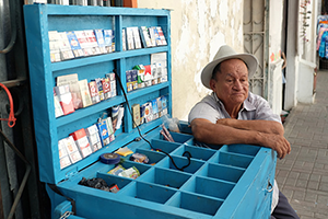 An image of an old man selling cigarettes 