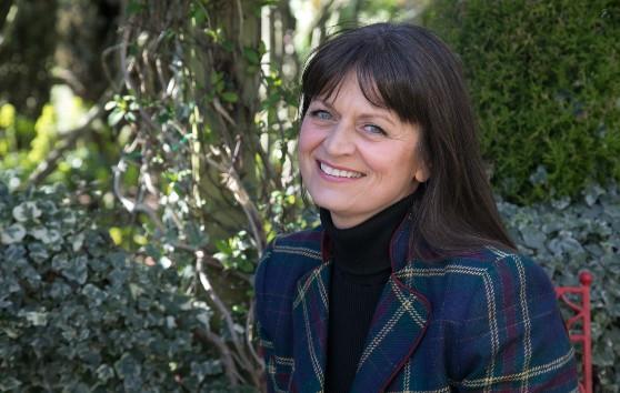 Garden designer Karen Tatlow posing outside