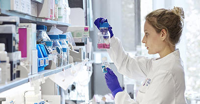 Scientist holding a flask in a lab